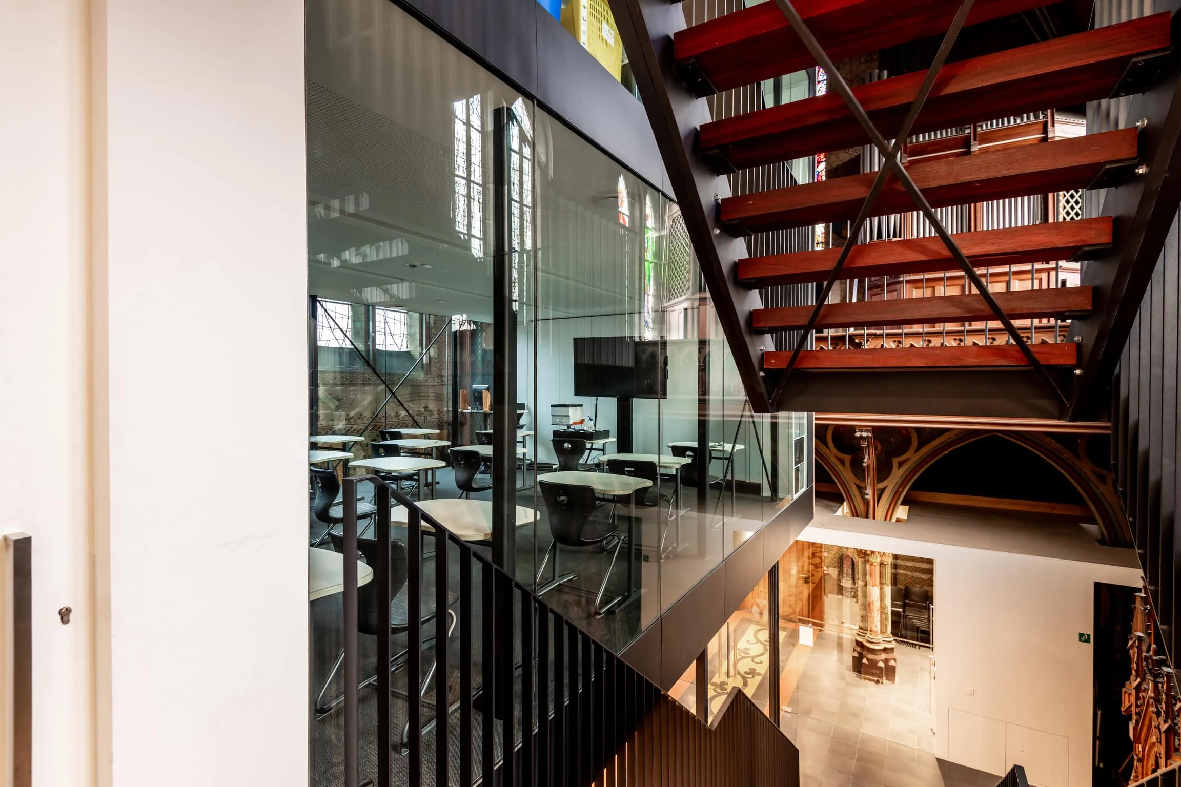 Modern office beside classic staircase