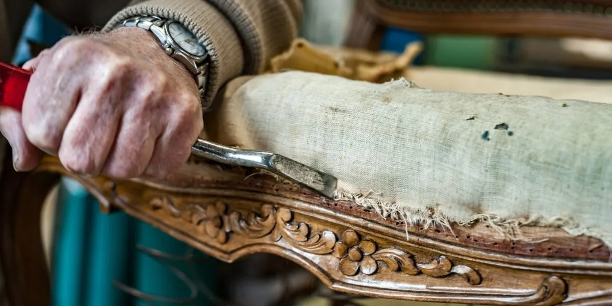 man working on a sofa