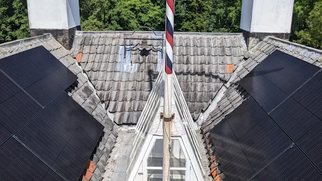 Interior roof of historic building with solar panels
