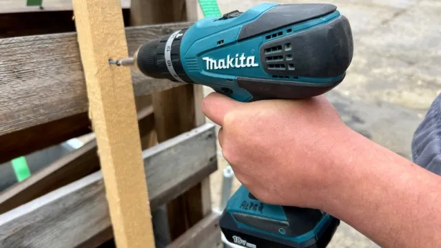man working with Makita cordless drill