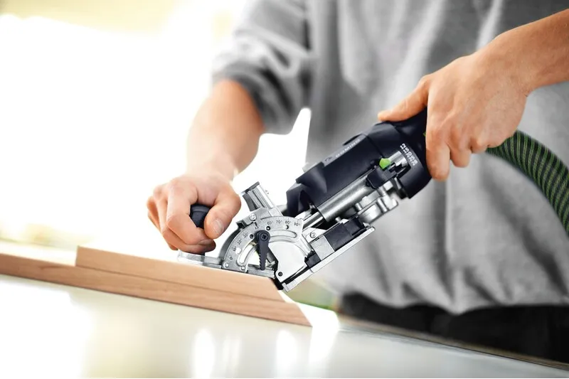 man works with Festool Domino cutter