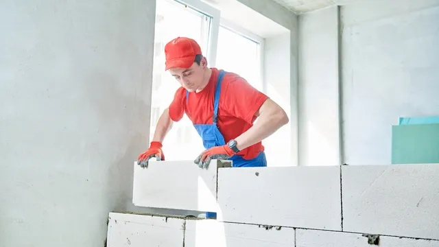 man glues guest concrete blocks
