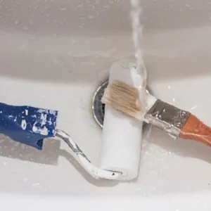 cleaning paintbrush and paint roller