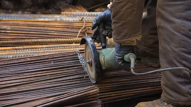 man cutting rebar