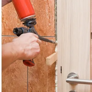 man-hand-using-spray-gun-filling